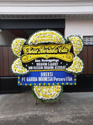 Papan Bunga Duka di Toma
