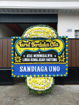 Papan Bunga Duka di Toma